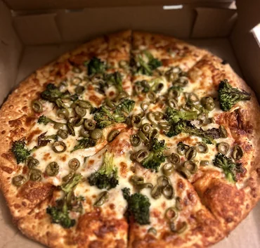 Broccoli and green olive pizza