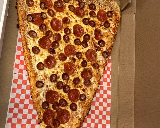 Giant pepperoni pizza slice on red and white checkered paper