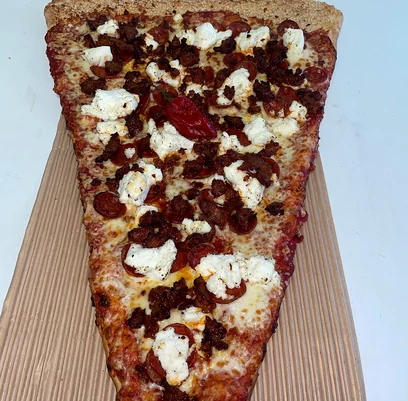 Giant pizza slice with spicy Italian sausage and ricotta