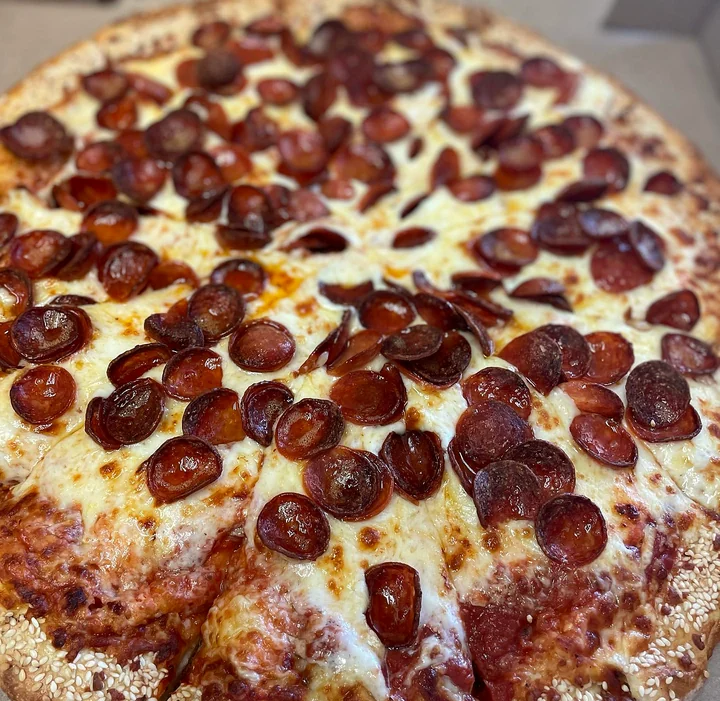 Pepperoni and roni cup pizza with a golden crust