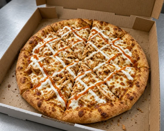 Shawarma pizza with shredded chicken shawarma and a lattice of garlic and hot sauce, in an open pizza box